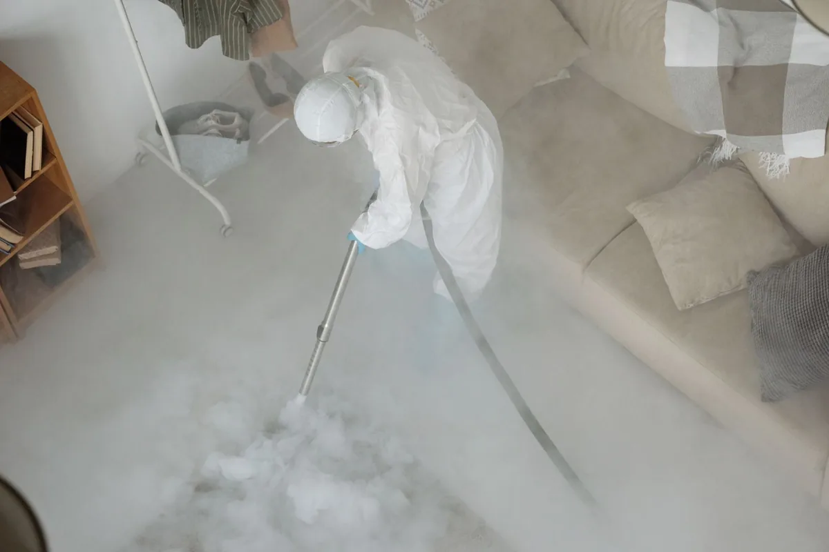 Biohazard cleanup technician in protective equipment, Hamlin, WV